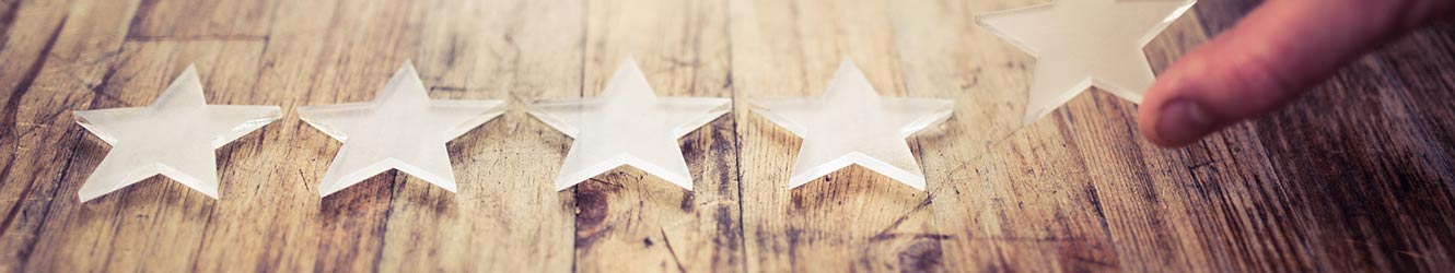 Person laying down stars on a wooden table.